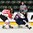 GRAND FORKS, NORTH DAKOTA - APRIL 18: Canada's Owen Tippett #21 grabs hold Slovakia's Peter Bjaloncik #25 during preliminary round action at the 2016 IIHF Ice Hockey U18 World Championship. (Photo by Minas Panagiotakis/HHOF-IIHF Images)

